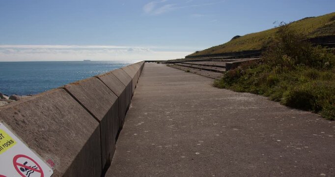 Extra wide shot of English Channel sea defences at sapphire hoe Country Park sea