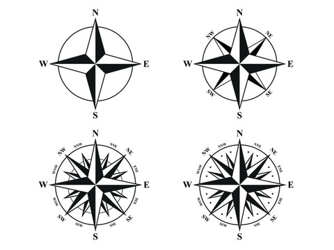 Set of black and white compass rose icons in different styles, including 4-point, 8-point, and 16-point variants with cardinal and intercardinal directions. Clean vector navigation symbols isolated