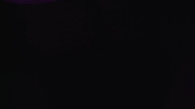 light leak and bokeh overlay with purple and green hues, perfect for adding artistic flair or transitions to video projects.