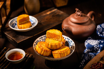Fototapeta premium Mid-Autumn Festival Mooncakes with Traditional Tea Service