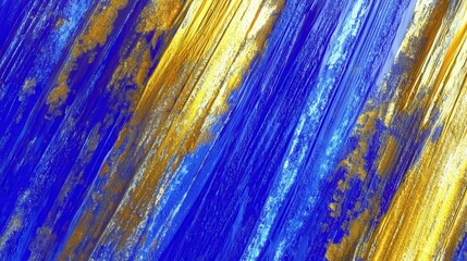 Thick brush strokes display vibrant shades of yellow and blue with unique textures and patterns in acrylic paint across the canvas in an arts studio