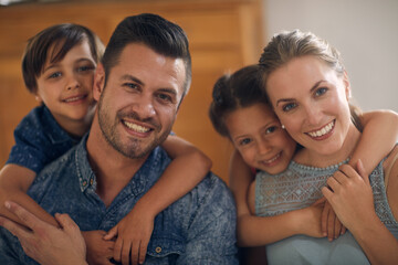 Obraz premium Portrait, family and children in home with hug, connection and bonding together on weekend break. Happy people, parents and kids in house with childhood development, support and embrace on holiday.