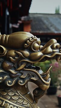 Chengdu, Sichuan, China. Bronze Lion Head Sculpture. Statue Of Mystical Chinese Guardian Lion. Head Of Golden Lion Statue At Wenshu Monastery. Sculptures Of Kylins Or Qilin. Kylins Is Mascot Dragon In