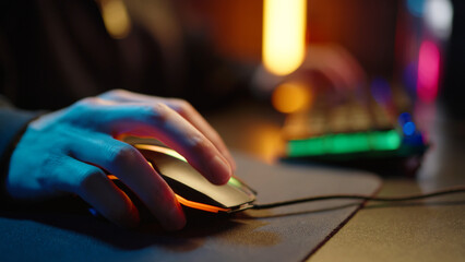 Gamer man playing online video game on computer closeup. Esport concept gaming virtual entertainment. Cyber e sport videogame tournament hands control mouse keyboard close up. Neon light. Player level © Татьяна Епанешникова