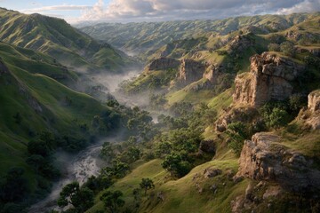Aerial view of a lush valley with rolling hills, fog, and a winding river