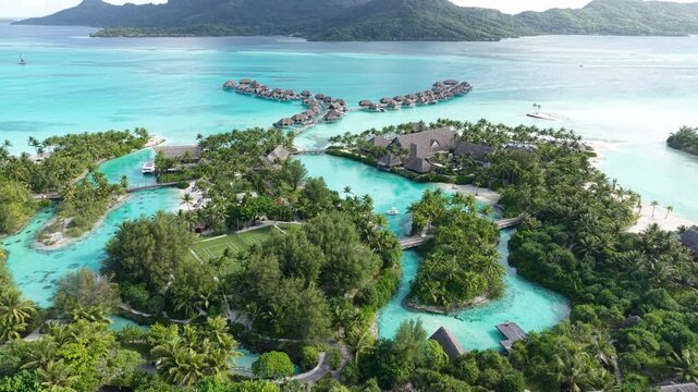 Bora Bora Island, French Polynesia. Drone Shot of Luxury Resort, Lagoons and Bungalows Over Water