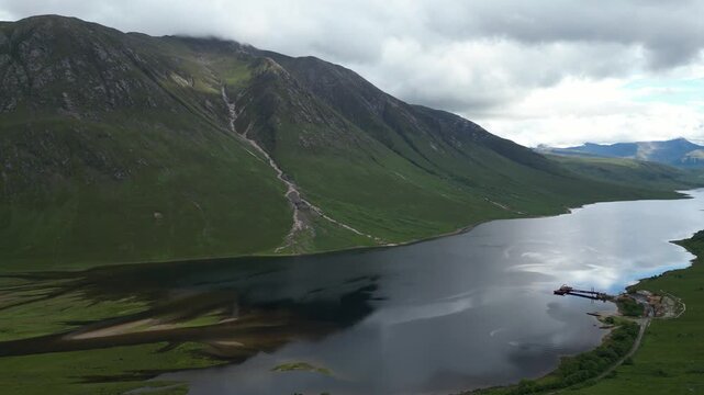 High altitude aerial drone footage of Loch Etive in the Scottish Highlands showing dramatic mountain landscape and scenic water views.