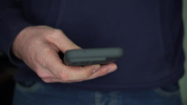Smartphone Check, Guy Takes Phone From Jeans Pocket for a Quick View and Puts it Back in. Phone Behaviour