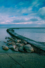 Fototapeta premium Concrete embankment at sunset in Neringa, Lithuania