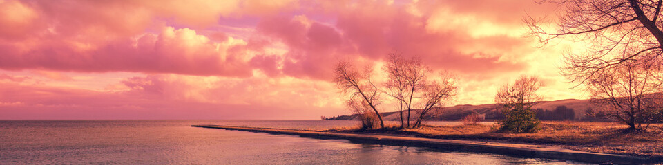 Fototapeta premium Embankment at sunset in Neringa, Lithuania. Curonian Spit