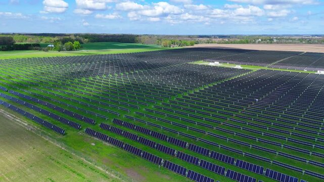 Solar array creating clean power in Blue Elk Solar Field in Adrian, Michigan generating renewable electricity