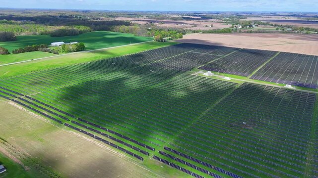Solar panels covering expansive land, collecting sunlight for sustainable power generatBlue Elk Solar Field, Adrian Michigan, USA