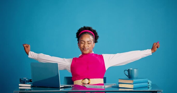 Stretch, done and laptop with business black woman for completed deadline, research article and relax. Journalist reporter, books and finished report with person on blue background for satisfaction