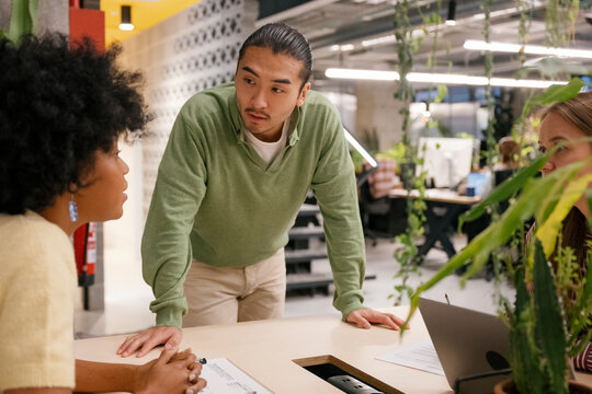 Business team brainstorming and discussing solutions at the office