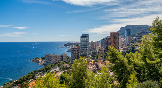 Monaco skyline with high-rise buildings and yachts along Mediterranean coast