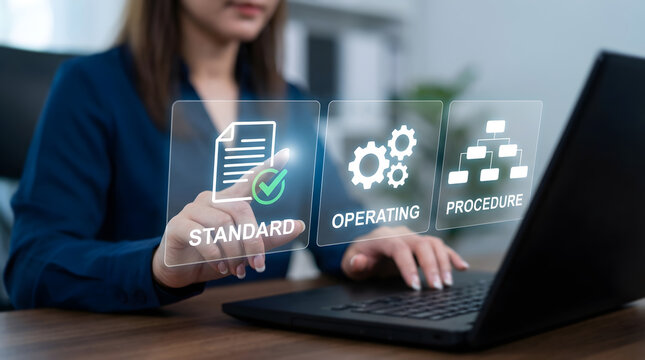Businesswoman Touches Standard Operating Procedure Icons with Document Checkmark Gear and Flowchart on Laptop Screen in Modern Office