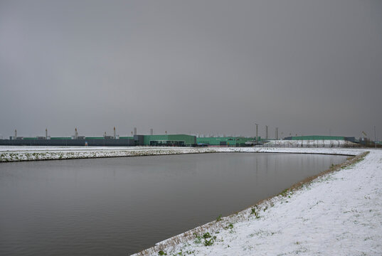 Modern data center in Middenmeer the Netherlands with snow and pond