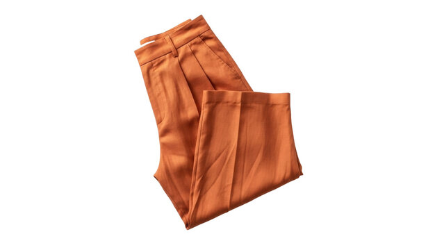 Isolated terracotta-colored dress pants are folded, waist showing, with a casual, fashionable look.