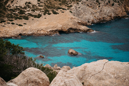 Turquoise water and limestone cove at Cala Figuera, Mallorca, Spain