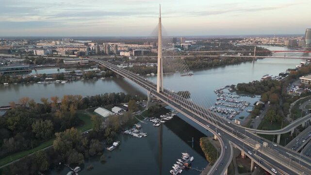 Ada bridge spans river Sava in Belgrade, Serbia. Aerial perspective, panoramic view captured by a drone.
