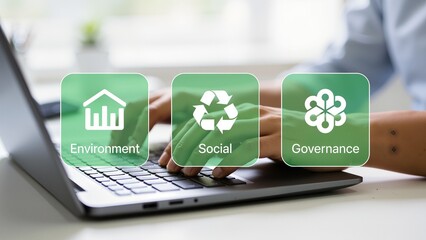 Hands typing on laptop with ESG icons
