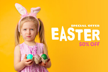 Fototapeta premium Happy Easter celebration with a child holding colorful eggs