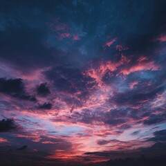 Vivid sky showcases stunning sunset hues with swirling clouds creating a dramatic scene