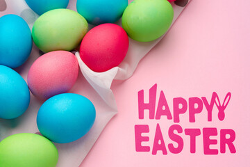 Fototapeta premium Colorful eggs are arranged on a surface for a happy Easter celebration in springtime