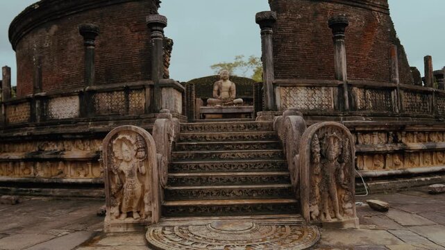 Stone steps with moonstone carvings leading to Buddha statue at Vatadage temple in Polonnaruwa, Sri Lanka