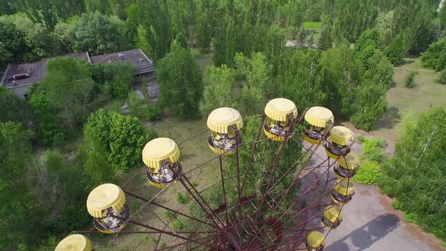 Aerial view of the abandoned Ferris wheel in Pripyat, Ukraine. Rusted and overgrown, a symbol of the Chernobyl disaster.