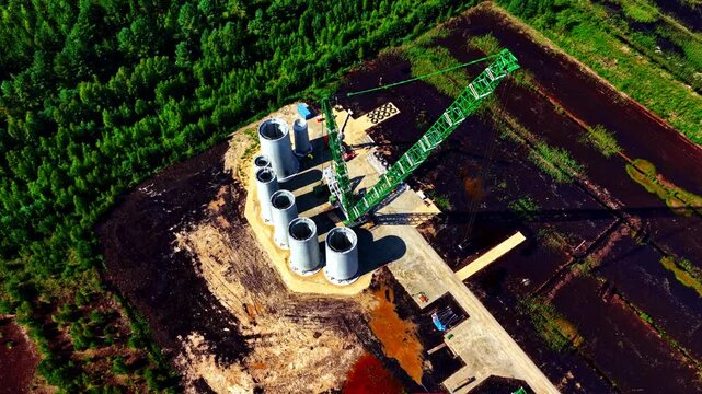 Wind park turbine construction using large crane in rural Latvia