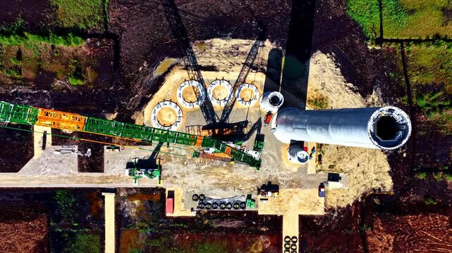 Wind park turbine construction topdown ascending aerial view