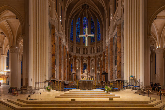 Interior view of Chartres Cathedral, a UNESCO World Heritage Site in France, with Gothic nave, altar, soaring columns and stained glass in a grand sacred architectural setting.