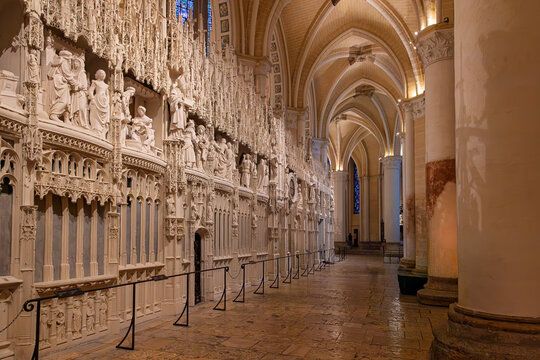 Sculpted choir screen and side aisle inside Chartres Cathedral, a UNESCO World Heritage Site in France, highlighting intricate Gothic stonework, arches and historic sacred interiors.