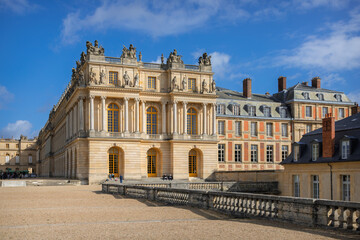 Fototapeta premium Monumental exterior wing and terrace balustrade of the Palace of Versailles, showcasing ornate classical royal architecture, UNESCO World Heritage Site, near Paris, France