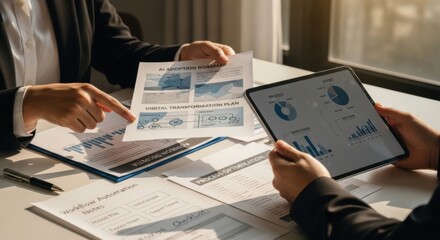 Business meeting reviewing digital transformation roadmap and data