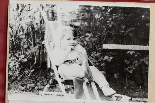 Soviet girl a small child. Old vintage sepia photograph taken in the USSR in the 1983