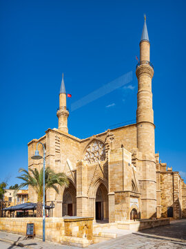 Selimiye Mosque, Nicosia, Cyprus, former Gothic St Sophia Cathedral converted into a mosque, historic sandstone architecture with twin minarets under blue sky