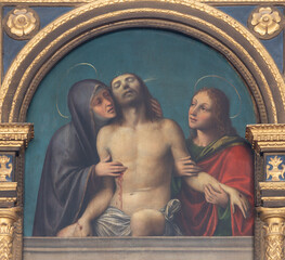 Naklejka premium VIGEVANO, ITALY - JANUARY 18, 2026: The renaissance painting of Lamentation over death Christ (part of Polyptych) in the church Cattedrale di Santa Maria Assunta by Bernardo Ferrari (1495 - 1574).