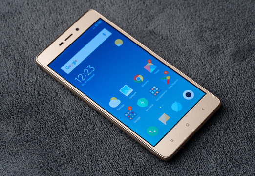 Dnipro, Ukraine 03.11.2025: Xiaomi Redmi 3S. A classic smartphone with a touchscreen and physical home button. Ideal for app mockups, mobile tech concepts, and vintage electronic themes.	