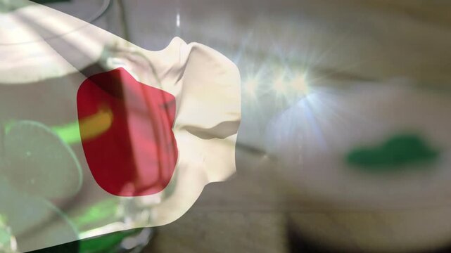 Translucent cloth rippling from breeze, overlaying pint glass, creating starburst reflections