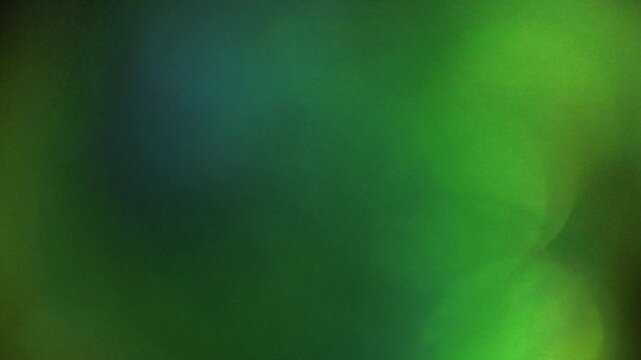 Light leak and bokeh overlay with green and blue hues, creating a dreamy, atmospheric effect. Perfect for adding visual flair to any project.