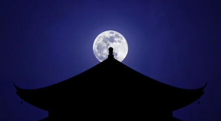 Full moon rising above temple roof symbolizing spirituality and serenity