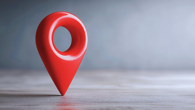 Red 3D map pin icon on a wooden surface location marker