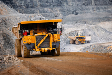 Banner open pit mine industry, big yellow mining truck for gold ore. © Parilov
