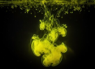 Vibrant Yellow Ink Cloud Explodes Underwater Against a Deep Black Background With Delicate Droplets Suspended In The Dark Liquid Environment