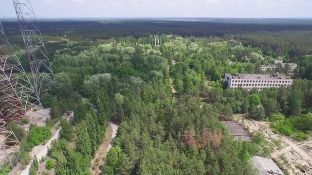 Aerial view of the Chernobyl exclusion zone, featuring the Duga radar array and abandoned buildings.