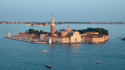 San Giorgio Maggiore island with Palladian church and campanile over Venetian lagoon © tilialucida