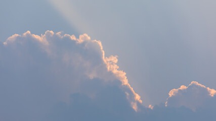 Backlit Cumulus Clouds With Sunset Sunbeams and Warm 