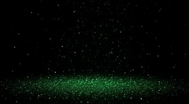 Falling Green Glitter Dust on Dark Background with Reflective Floor for Luxury Cosmetics and Gala Event Design